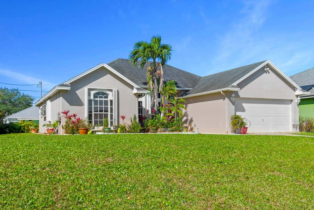 Photo of 1662 SW Victor Lane, Port Saint Lucie, FL 34984 (MLS # R10970354)