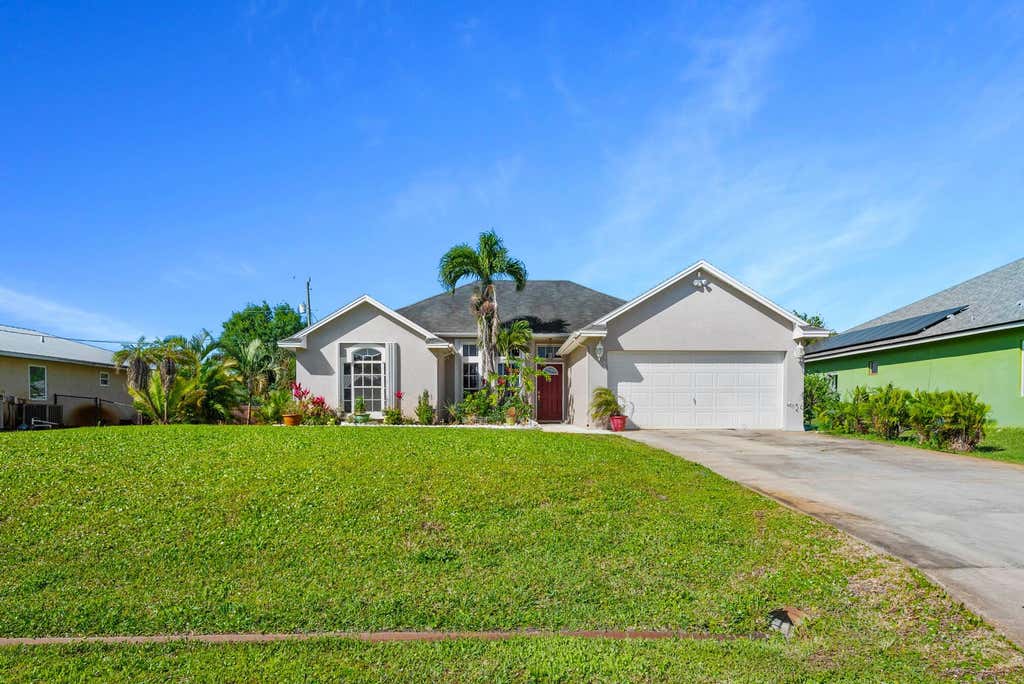 Photo of 1662 SW Victor Lane, Port Saint Lucie, FL 34984 (MLS # R10970354)