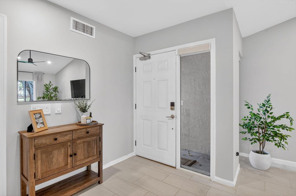 Photo of 5530 Coach House Circle #A, Boca Raton, FL 33486 (MLS # B26021076)
