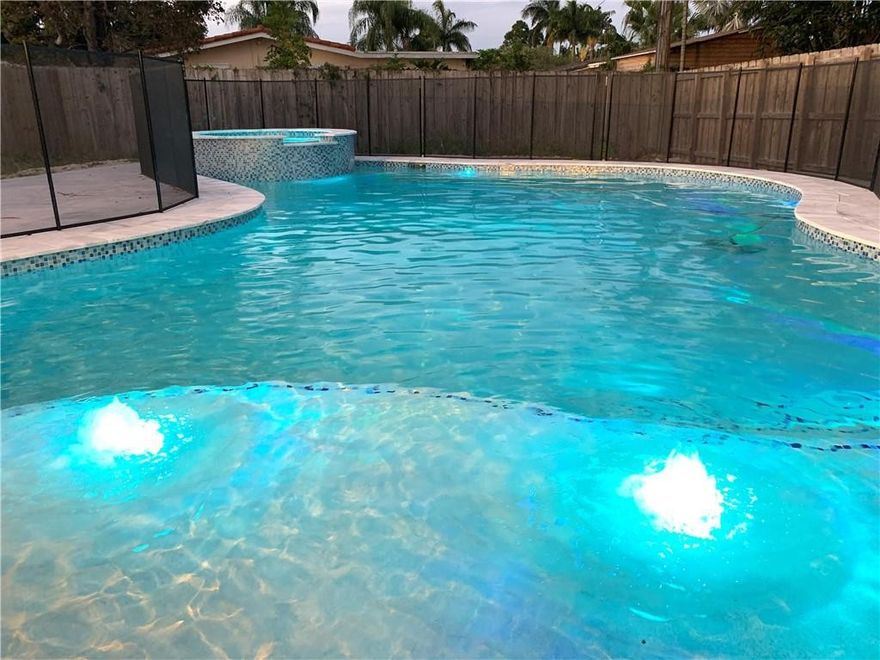 FANTASTIC CENTRAL LOCATION, LOVELY SUPER QUIET STREET WITH NICE HOMES ON THE WATER JUST ON OTHER SIDE, HUGE BACKYARD WITH LARGE PATIO/DECK TILED IN "ICE" 24" TRAVERTINE- ALL WHITE GORGEOUS! HURRICANE IMPACT WINDOWS AND DOORS, ELECTRIC WATER HEATER>>>>>>>SPECTACULAR BRAND NEW $78,000.00 POOL AND PATIO: LARGE 37' SALT SYSTEM, CUSTOM ELECTRONICS, LED LIGHTING, SPA, HEATER, SUN SHELF WITH BUBBLES, REMOVABLE BABY GATE. POOL IS A SHOW STOPPER! CONTROLLED FROM YOUR PHONE>>>>>>NEW KITCHEN WITH QUARTZ COUNTER TOPS, NEW APPLIANCES, WINE COOLER, TERRRAZO FLOORS THROUGHOUT. REVERSE OSMOSIS WATER SYSTEM, HOME IS NOT COMPLETED.