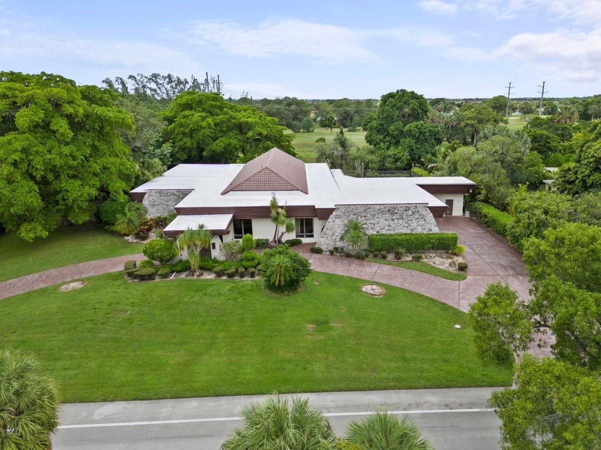 NO MANDATORY HOA FEES!!! Over 7,100 sq. ft adj. of style, comfort, and space! This light-filled mid-century modern home is perfect for large families or anyone who loves to entertain. Inside, you’ll find 5 bedrooms with a guest house plus an additional bonus room, 4.5 bathrooms, an executive office, a full bar, and a 3.5-car garage with a huge circular driveway. The open layout, upscale finishes, and architectural details earned it a feature on the cover of Palm Beach Magazine.
Step outside to your private backyard oasis with a large pool, sun deck, outdoor kitchen, and a separate guest house. Prime location with fast Turnpike access:
•20 min to the beach and Fort Lauderdale Airport
•15 min to Sawgrass Mills and the Hard Rock Guitar Hotel/Casino
•7 min to Inter Miami's Stadium.