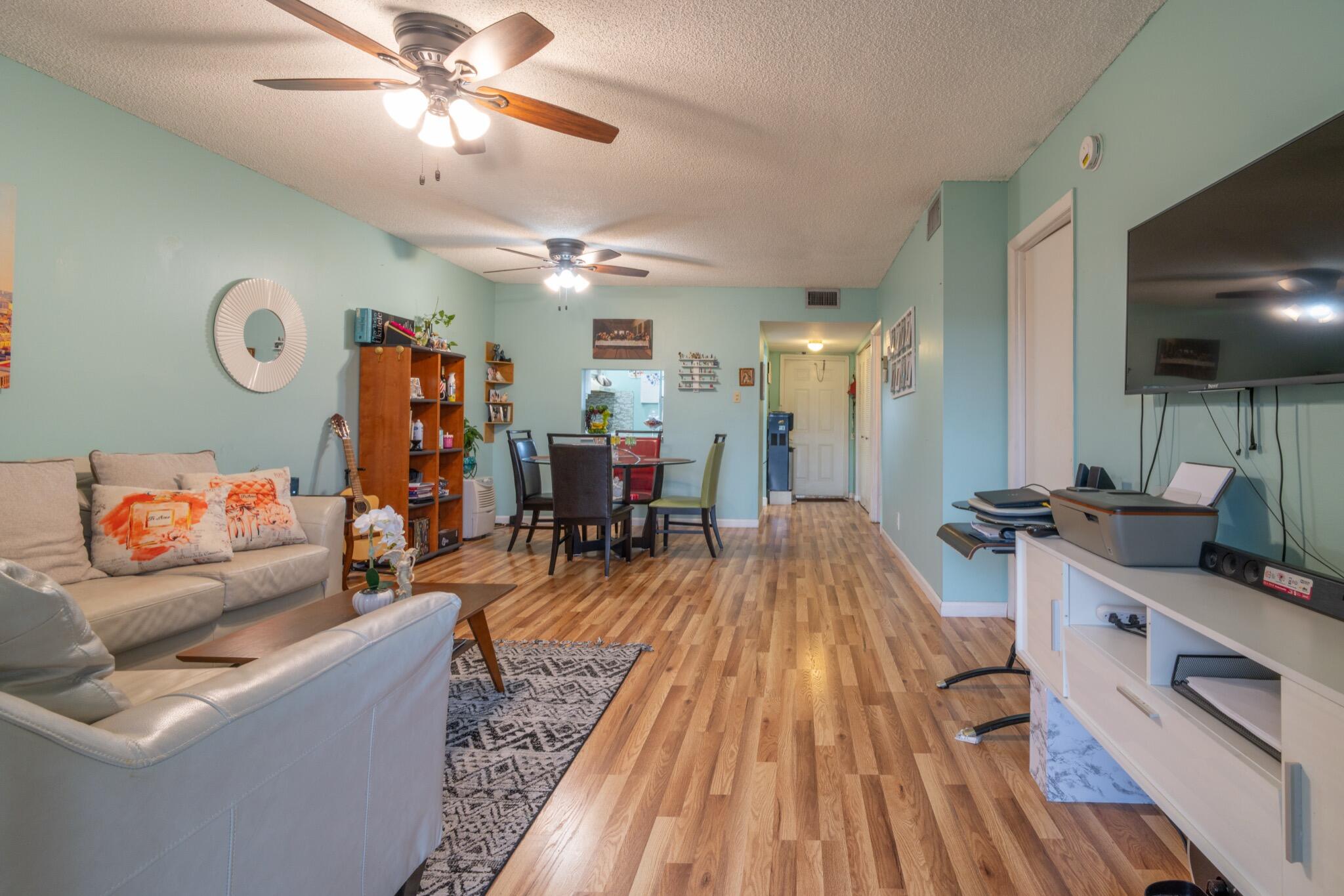 Lovely, spacious, and bright 2BR/2BA condo on the 2nd floor of a charming building in Margate's active 55+ community, Oriole Gardens. Features impact windows, shutters, and wood-look laminate floors. Prime location near bus stops, Publix, Walmart, restaurants, and just 15 minutes from the beach. Community offers 2 pools, fitness room, billiards, bunco nights, shuffleboard, and lush green areas. Peaceful setting with laundry facility and assigned parking. HOA includes water, sewer, cable, internet, and is paid quarterly. Assoc. requires 675+ credit, $35K income, 20% down, and 6 months of HOA fees held in escrow.