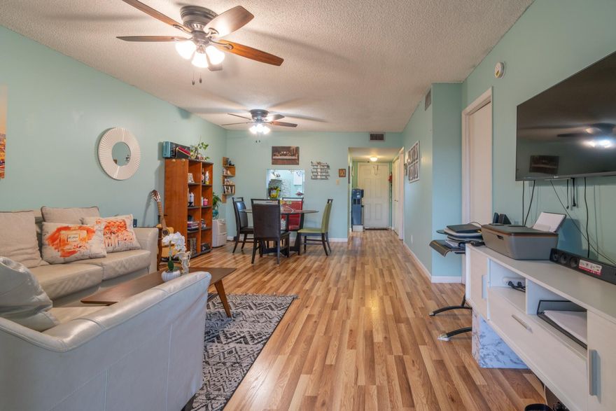Bright and spacious 2BR/2BA condo in Margate's vibrant 55+ Oriole Gardens community! Located on the 2nd floor of a charming building, this home offers impact windows, shutters, and stylish flooring. Enjoy easy access to bus stops, Publix, Walmart, restaurants, and just 15 minutes from beautiful beaches. The community features 2 pools, fitness center, billiards, bunco nights, shuffleboard, and lush green spaces perfect for relaxing or socializing. Includes laundry facilities, assigned parking, and a peaceful setting. HOA covers water, sewer, cable, and internet, paid quarterly. Association requires a 675+ credit score, $35K income, 20% down, and 6 months HOA fees held in escrow.