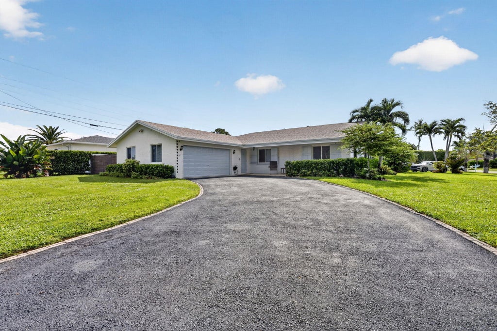 Photo of 617 Heron Drive, Delray Beach, FL 33444 (MLS # B26074840)