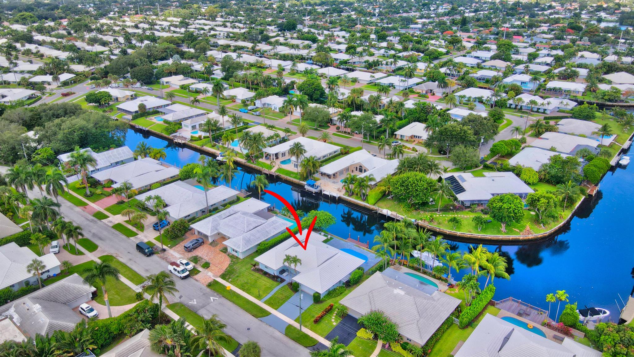 Dock your boat in your backyard living the Florida lifestyle boating, fishing ,paddleboarding & more . Camino Gardens is a prime east Boca location a bike ride away from the  Raton resort, Mizner Park and dozens of restaurants and shops and the beaches. Torally renovated  3 bedroom plus a den pool home w private dock. Great open floorplan w/ large covered patio offering an additional 600 SF + outdoor covered living space, New impact windows & doors 2022. Newer roof 2018, Newer AC , new hot water heater 2023, new appliances &washer/dryer, New Modern hi gloss white kitchen cabinets by Azzurri Kitchens w/ built in Fisher Paykel refrigerator & dishwasher, built in appliance pantry & gorgeous designer porcelain accent wall & white quartz waterfrall countertops with bar seating.