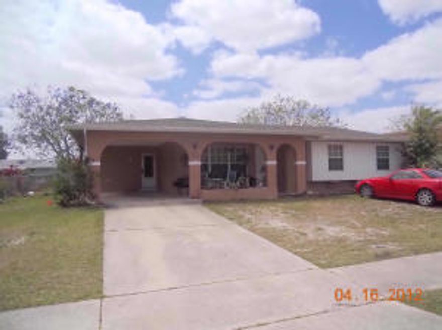 4 bedroom 2 bath CBS HOME with  large front porch and rear screened area.
