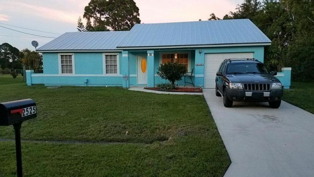 Photo of 2525 SE Richmond Street, Port Saint Lucie, FL 34952 (MLS # R10746498)