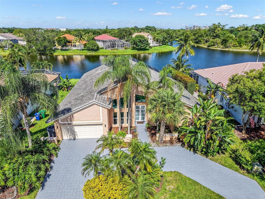 Step into this fully renovated home on lake with sleek new flooring throughout and soaring ceilings for a modern feel. The heart of the home is the chef’s kitchen, thoughtfully designed with quartz countertops, 42" solid wood cabinets, and top-of-the-line appliances installed in 2022. Bathrooms have been fully renovated with designer touches. Highlights include 2 new A/C units with upgraded ductwork, water heater replaced in 2020. Nest system, hurricane impact windows and doors throughout, and a new garage door system. New roof installed in 2021. Heated saltwater pool, internet-managed electric pool pump, outdoor shower, and all-new screens enclose the patio and total home surge protection all installed in 2021. New sprinkler system 2022.  A must see!