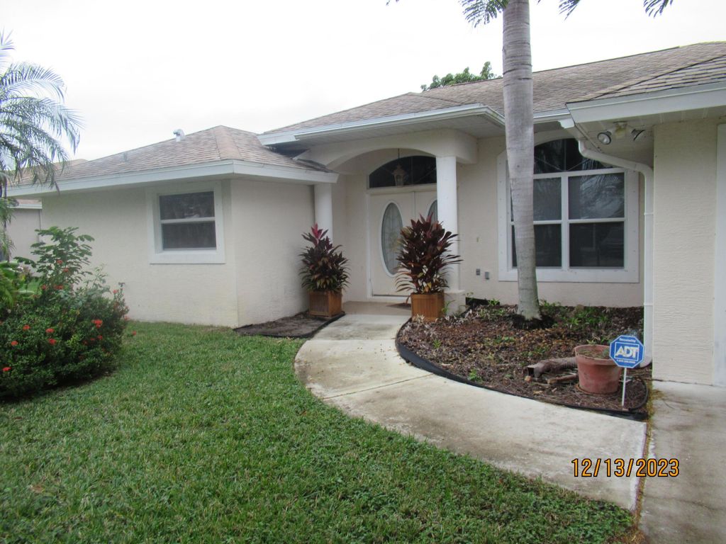 Photo of 2459 SE Pascal Avenue, Port Saint Lucie, FL 34952 (MLS # R10954856)
