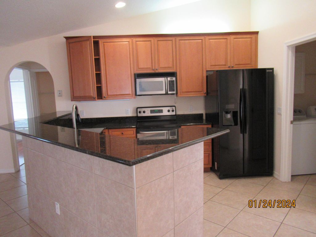 Photo of 2459 SE Pascal Avenue, Port Saint Lucie, FL 34952 (MLS # R10954856)