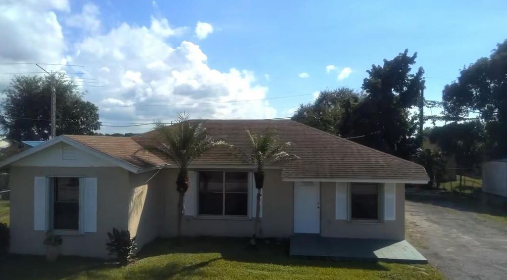 Photo of 832 SW Avenue I, Belle Glade, FL 33430 (MLS # R11134012)