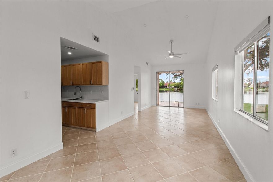 Stunning Lakefront Corner Villa!Newly renovated 3 bed, 2 bathroom villa, boasting breathtaking direct lake views! This rare gem has been meticulously transformed with modern finishes and sleek design elements.As you step inside, you'll be greeted by soaring high ceilings, abundant natural light with a sunroof. The master bedroom features a beautifully renovated bathroom with a modern new vanity, LED lighting, and a stunning glass tile shower with elegant gold finishes.Washer and dryer in the unit, plus two designated parking spots and outdoor storage space.Enjoy your patio, perfect for sipping coffee or enjoying a glass of wine while taking in the lake view. And, don't forget to bring your kayaks and paddleboards to enjoy the lake!Dont miss out on ! Close to Houses of Worship.