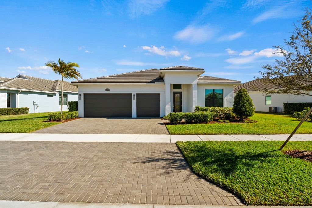 Photo of 9091 SW Arco Way, Port Saint Lucie, FL 34987 (MLS # R11158880)