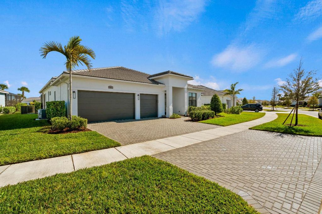 Photo of 9091 SW Arco Way, Port Saint Lucie, FL 34987 (MLS # R11158880)