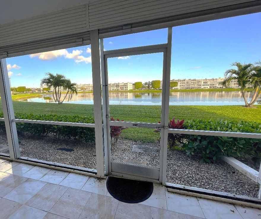 Come fall in love with this rarely available first floor, waterfront, two bedroom condo!  Live your best South Florida life in this light and bright unit. Both bedrooms offer water views. You will appreciate cooking in this thoughtfully designed kitchen for style and function. Lovely screened-in patio for relaxing and cool breezes. Century Village is a vibrant adult community offering a renovated clubhouse with a fitness center, pools, endless activities, including classes, social events, various clubs, and bus service. Fantastic location - just minutes to shopping, dining, beaches, commuter roads, golf, medical services, and more. Residents enjoy a 24-hour guard-gated community. This condo is the perfect blend of comfort and convenience. Enjoy your space, your pace, and your community.