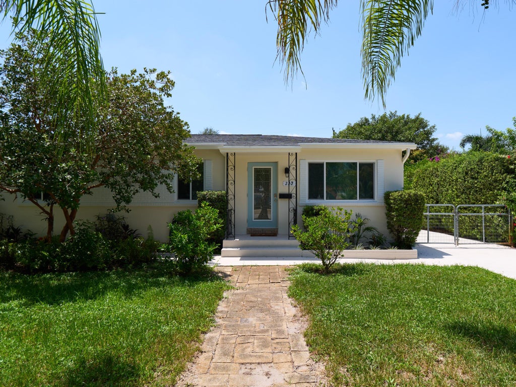 Photo of 222 Bayberry Drive, Lake Park, FL 33403 (MLS # B26066352)