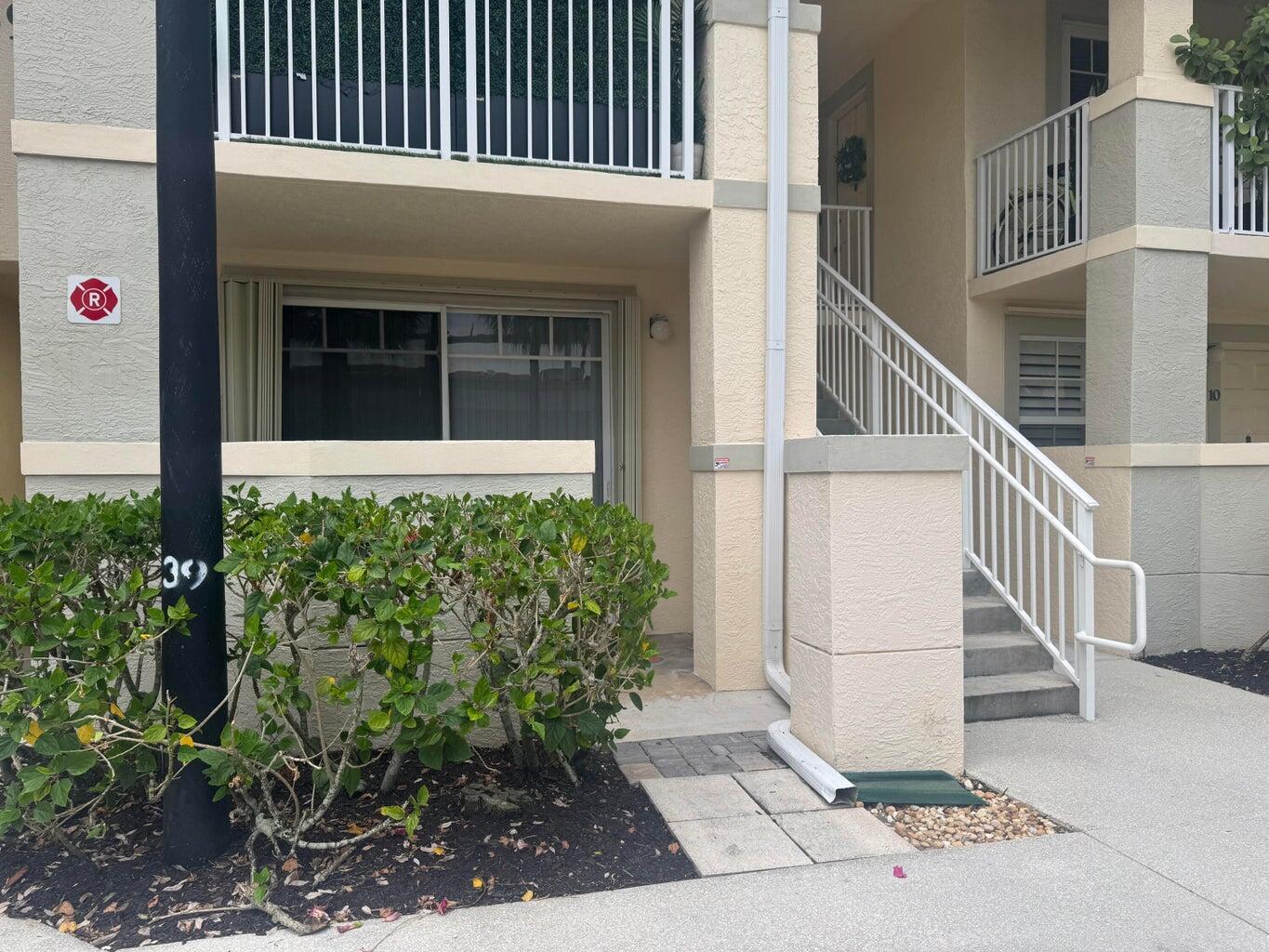This 1-bed 1-bath, ground floor condo is only steps away from Roger Dean Stadium, Florida Atlantic University, shops and restaurants. Immaculate and pristine, this condo offers a brand new washer and dryer, Spacious living area, large walk-in closet in the primary + a separate linen closet, 2 covered patios, and 1 assigned parking spot. Freshly painted, this condo has porcelain tiles throughout, accordion hurricane shutters all around, and a fantastic floor plan.