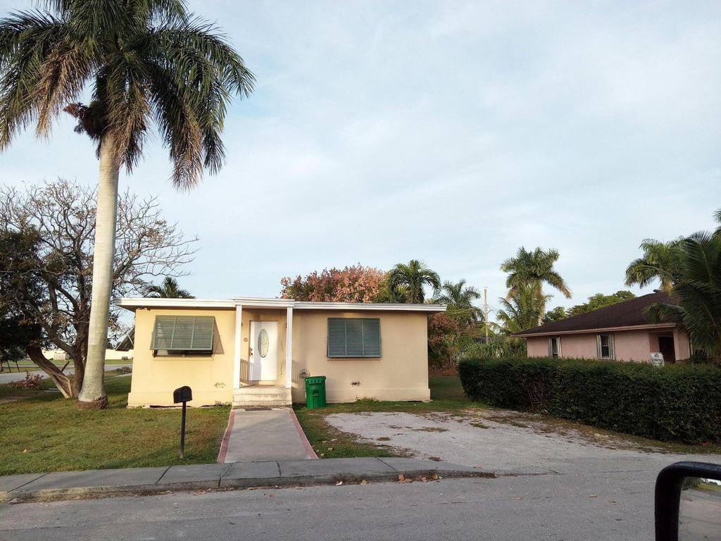 Photo of 397 Cypress Avenue, Pahokee, FL 33476 (MLS # R11050813)