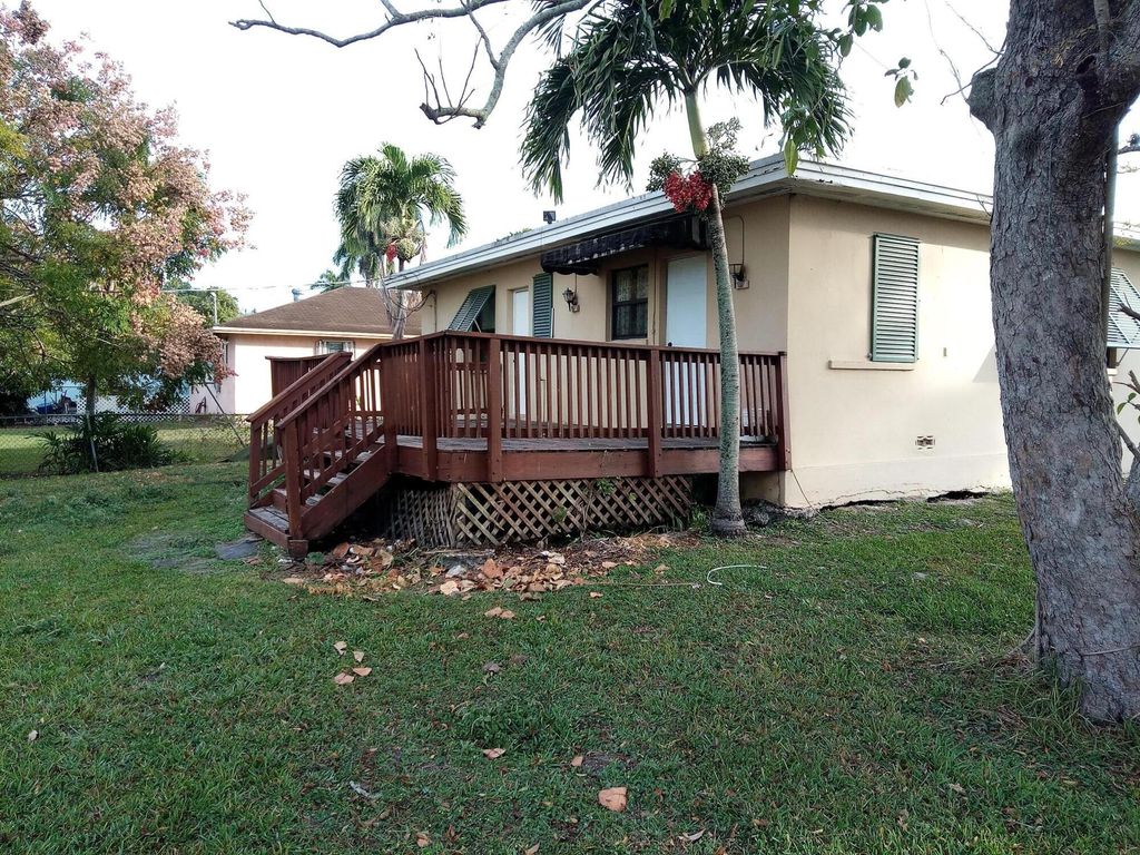 Photo of 397 Cypress Avenue, Pahokee, FL 33476 (MLS # R11050813)