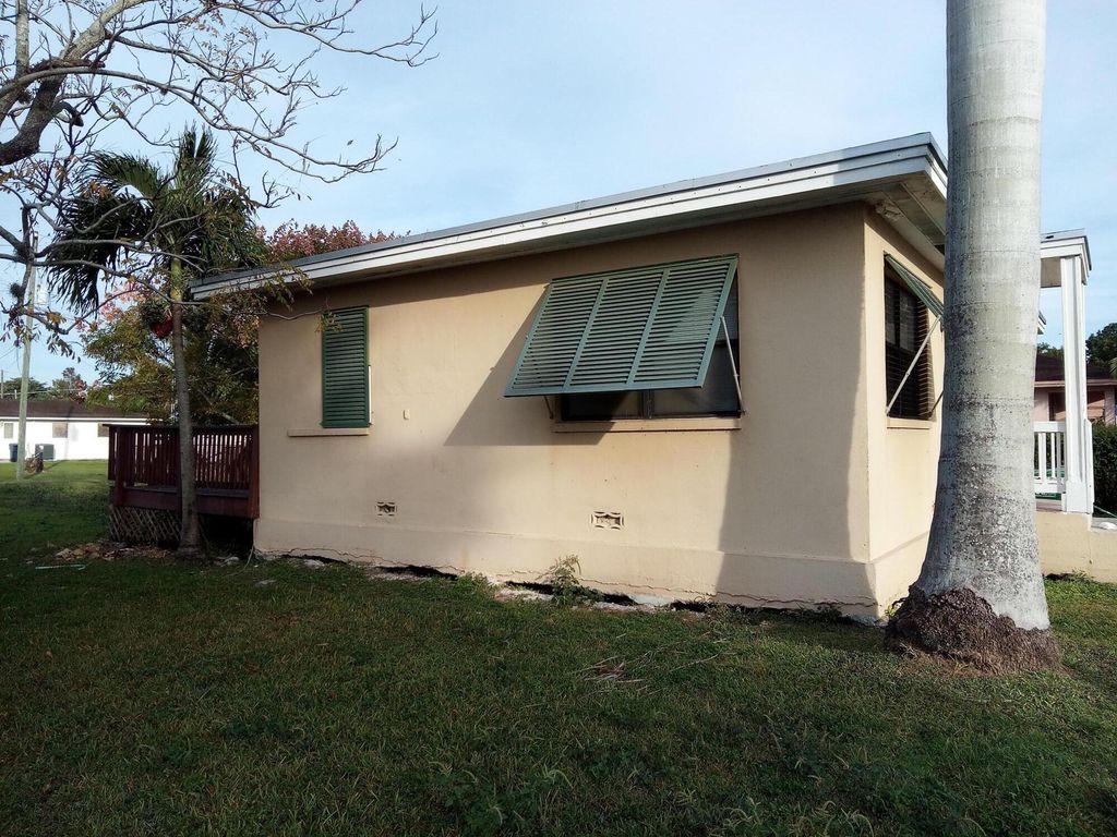 Photo of 397 Cypress Avenue, Pahokee, FL 33476 (MLS # R11050813)