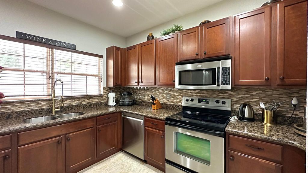 Photo of 4702 Cohune Palm Court, Greenacres, FL 33463 (MLS # R11115131)