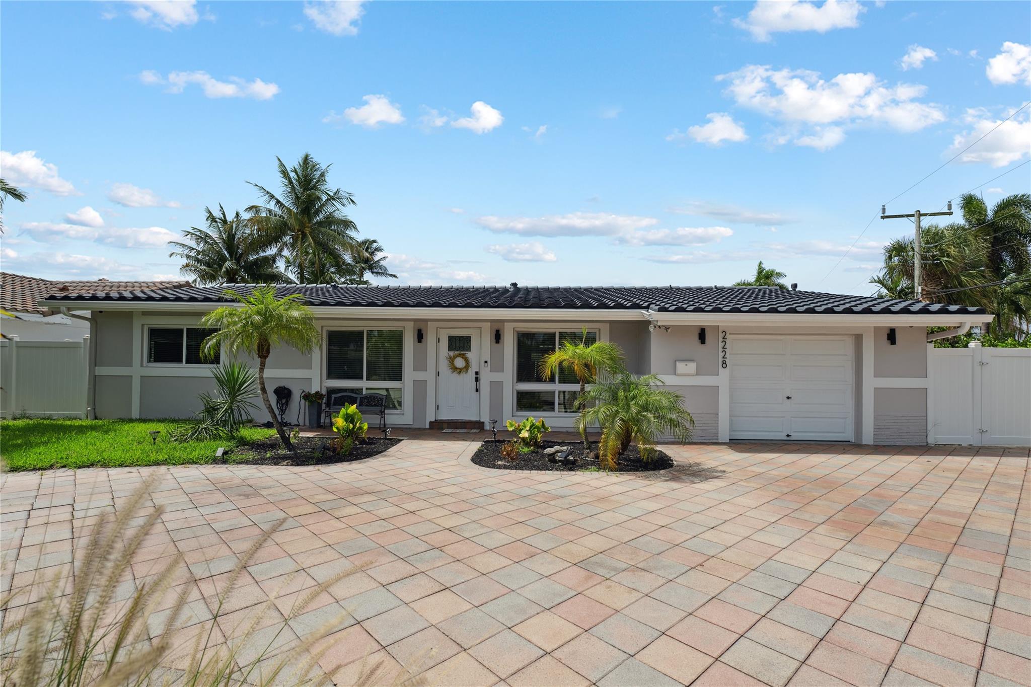 Paradise in Pompano in this updated 3 bedroom and 2 bath water front home. Open floor plan, updated kitchen with all new appliances. If you like the outdoors you will love the back yard. All new tiki bar, boat lift and fire pit. Heated salt water pool. 100 feet of water frontage and a boat lift with no fixed bridges for ocean access. South East exposure gives you the perfect amount of sun all year long. This is a must see.