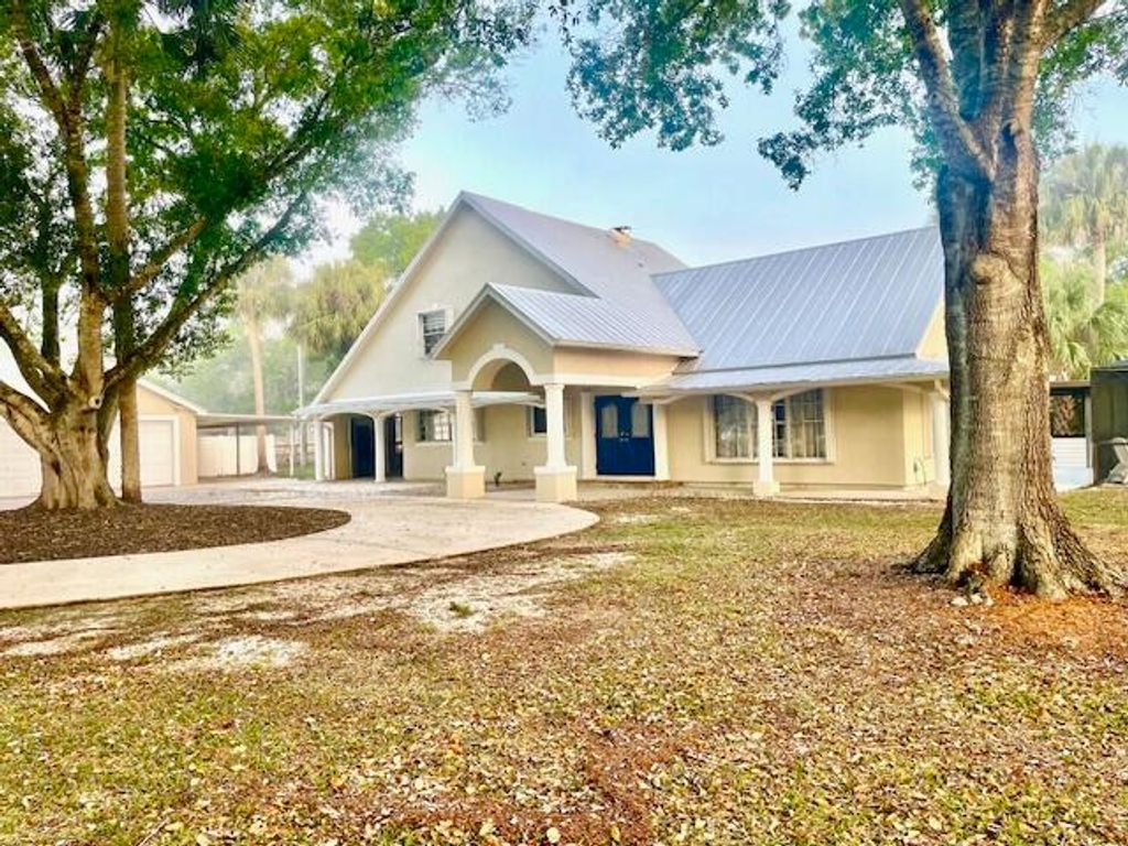 Photo of 17280 Hammock Lane, Port Saint Lucie, FL 34987 (MLS # B26001543)