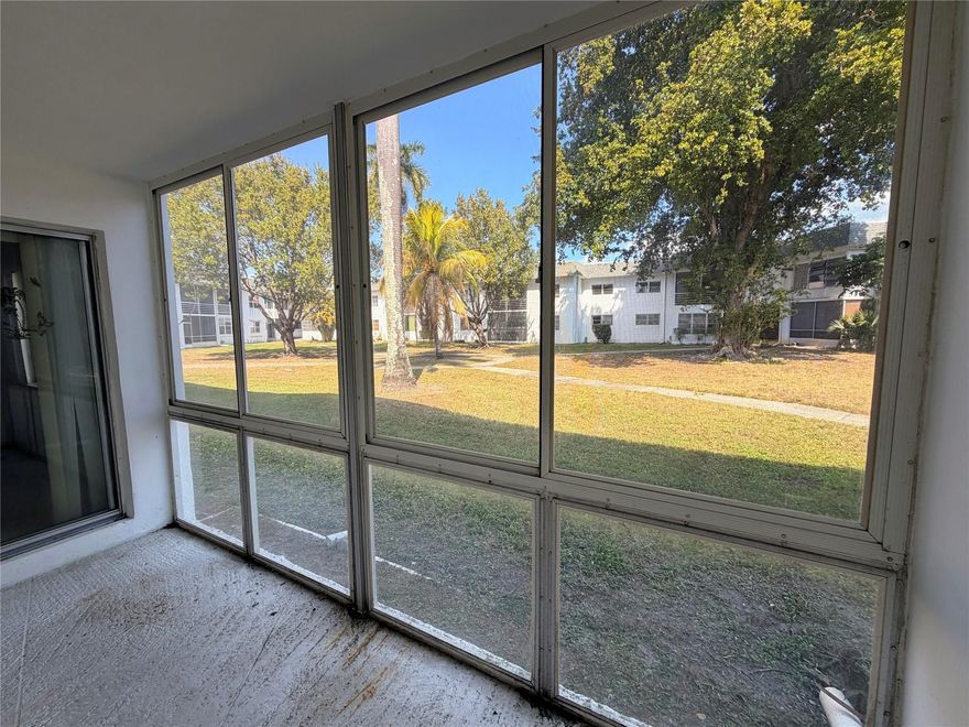 Amazing investment opportunity or great to make your own home! All ages welcome. Brand new, gorgeous tiles throughout. Brand New stainless steel appliances, refinished counter tops. Conveniently located on the first floor, this condo features a spacious living areas and a bedroom big enough for a king bed. There is a half bath for guests. Enjoy a lovely courtyard view. The water heater was installed 1/2024, new AC in 7/2025. There is extra storage in the community storage room. On site laundry, one assigned parking space and plenty of guest parking.