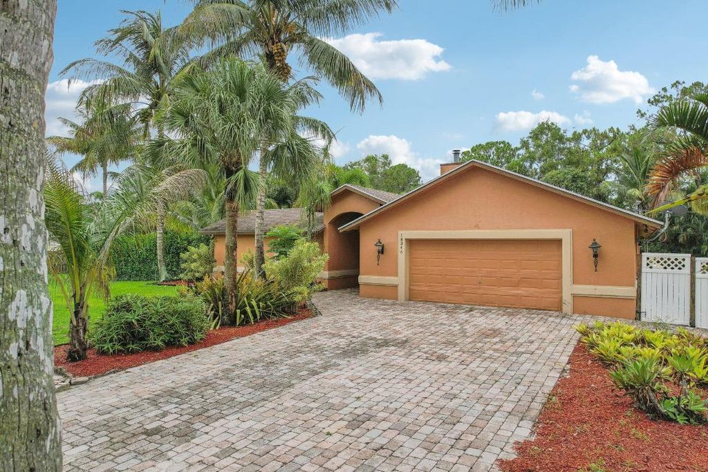 Photo of 18346 93rd Road N, The Acreage, FL 33470 (MLS # R10997043)