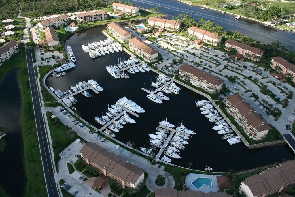 Photo of 1701 Marina Isle Way #103, Jupiter, FL 33477 (MLS # B26023538)