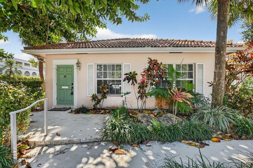 End unit villa just two blocks from the beach in one of Boca Raton's most desirable locations! Perfect opportunity to enjoy coastal living at its best. Spacious living room features custom built-in cabinets and drawers, along with a formal dining room. Updated kitchen offers granite countertops, stainless steel appliances, and a sleek hood.  Impact glass windows and doors, and marble floors run throughout the home. Air-conditioned sunroom adds valuable extra living space. 2nd bedroom includes a closet with built-in shelving, and the second bath features a tub with glass enclosure. Master suite offers built-in shelving in the closet, high-hat lighting, and a master bath with one sink and large shower. Crown molding throughout and one assigned parking space.