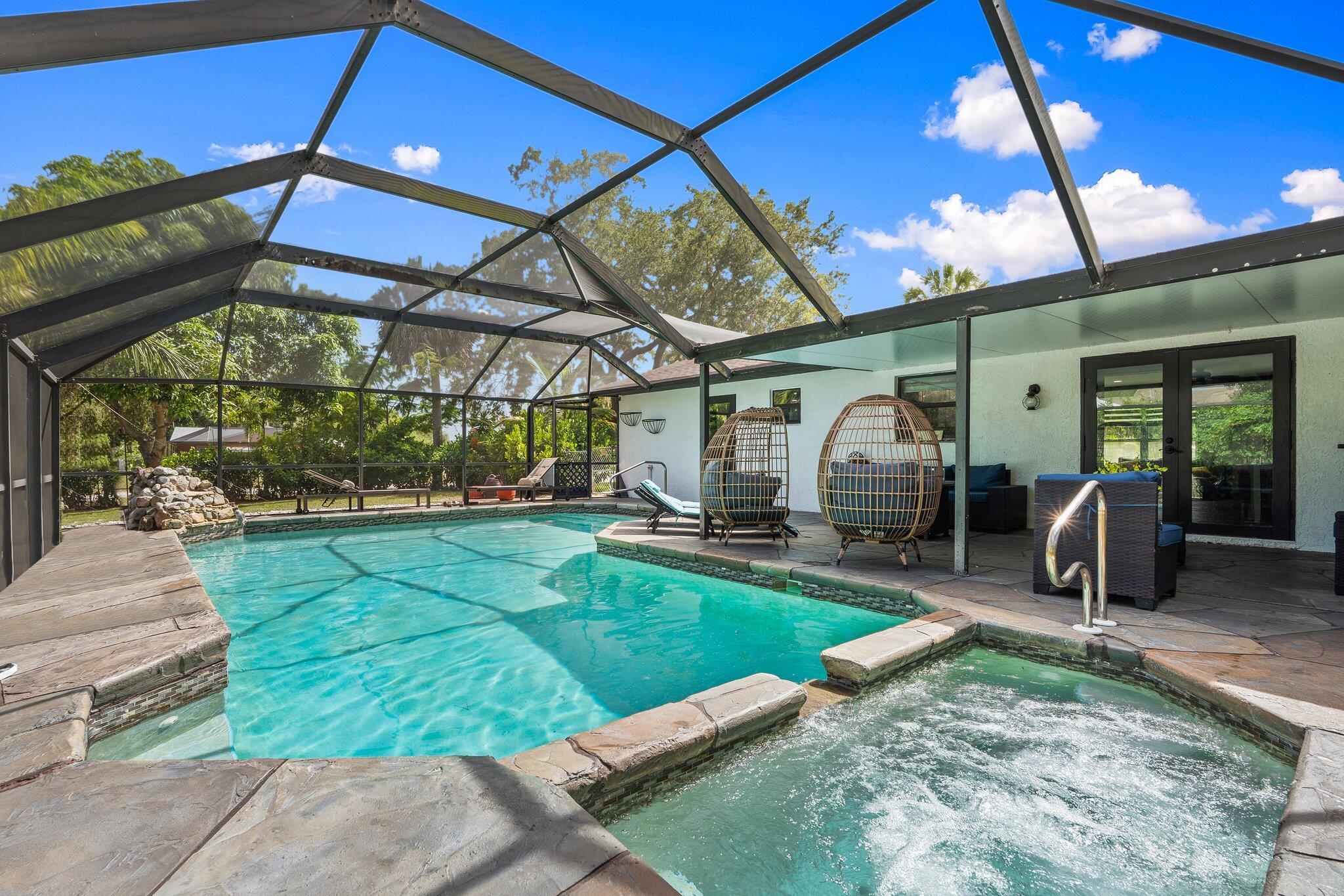 Discover a rare gem in Lakewood Park! This spacious pool home sits on a generously sized 0.36-acre corner lot, conveniently located directly across from one of the community's two public green spaces. The interior has undergone a comprehensive renovation, transforming it into two primary en-suite bathrooms. The home retains its modern appeal with contemporary finishes and a new roof installed in 2022, along with updated windows throughout the same year.Entertain friends and family in your contemporary kitchen, showcasing your new appliances, including an induction range, shaker-style cabinets, tile backsplash, and granite counters. All three bathrooms have been tastefully renovated, each featuring a unique design concept. The pool is enormous and features a heated pool and spa.