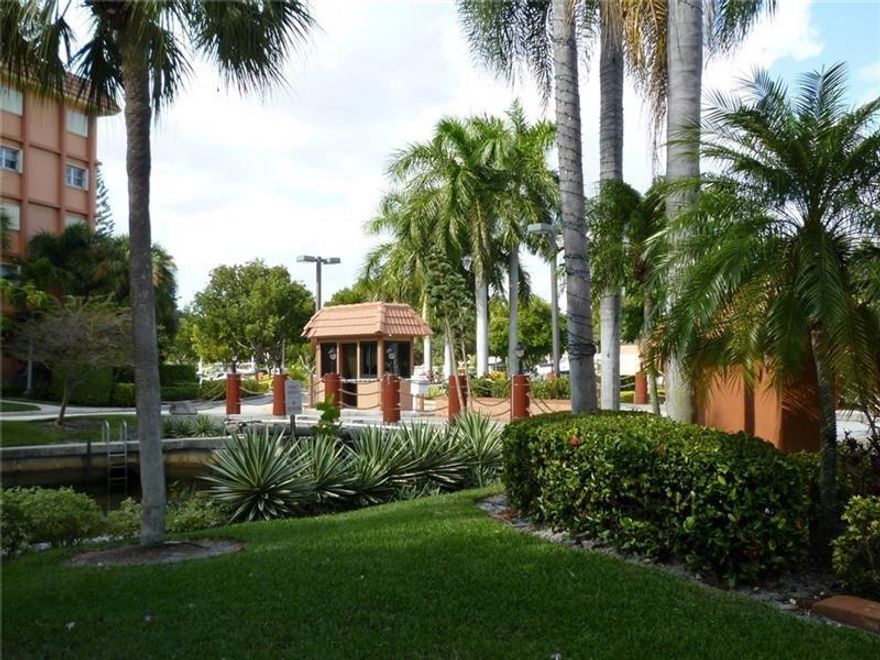 Southern pool and waterway views from your balcony. Large windows overlooking pool area, boats and south canal. Tile floors in living and bedroom areas; ceramic tile in kitchen and bathrooms. This unit is perfect for someone looking to remodel the unit to their stardards. Utility room with air handler, water heater, and washer/dryer plus built-in shelves for extra storage. Unit includes storage locker and assigned parking. Pet-friendly, gated waterfront community with 24-hour staffed guardhouse, heated pools, showers, tennis courts, gym, kayak/paddle board and bike storage. Dock up to 50' available. Minutes to downtown, Las Olas, beaches, restaurants, shopping, airport, expressways