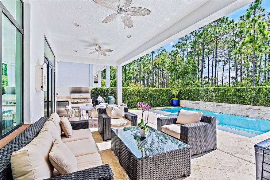 This amazingly upgraded 5BR + den/5BA/3CG pool home features a spacious open floor-plan; 20 ft. custom ceilings with crown molding; tongue & groove beamed ceilings, gourmetkitchen with double stacked cabinets, GE Monogram appliances and large island with quartz counter-tops. The York Model layout provides more square footage than any other model within the community. In addition, designer light fixtures, custom draperies & plantation shutters are included alongside a spacious master bedroom including a luxury master bath,built-in cabinetry, two refrigerators, loft, en-suite bathrooms attached to each bedroom with a covered loggia, summer kitchen & salt water pool with spa!