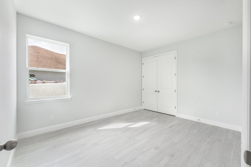 Photo of 1825 SW Millikin Avenue, Port Saint Lucie, FL 34953 (MLS # R11065035)
