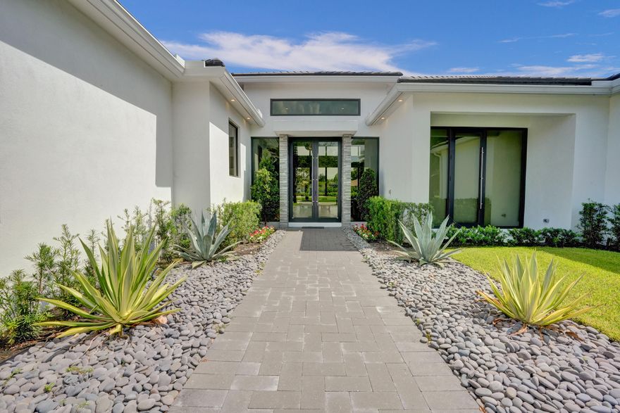 Magnificent custom estate home located in the prestigious gated community of Steeplechase in Palm Beach Gardens. Beautiful piece of land with plenty of room to build a tennis court , mother in law or basketball court.
This luxury residence was Built in 2022 and features 5 bedrooms flex space currently an office, a resort style pool. Outfitted with modern finishes, this home boasts a large chefs kitchen cabinetry from exclusive European design ''Azzurri'' walk-in pantry wine cooler,2 ovens. Additional amenities within the home include grand owner's suite, luxurious his and her bathrooms vanity and his and hers toilets room. The house is equipped with a special water filtration system. Perfect for entertaining or just enjoying your slice of paradise in peace and quiet. Summ Kitchen with retractable hurricane proof screens 
Beautiful resort salted water pool and spa . Heat is electric or gaz, huge back yard with canal isn the  back. This residence is perfect for the most discerning buyer looking for the ultimate in luxury, privacy, and comfort offering every modern convenience. This is a true gem in the heart of Steeplechase.