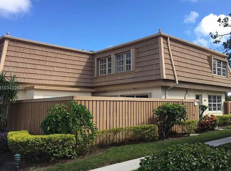 Welcome to this Palm Beach Gardens townhome—a well-maintained, thoughtfully updated residence with a layout that works just as well outside as it does inside.  The main living area offers a comfortable, open flow that feels natural and easy to use. Upstairs, updated flooring brings a clean, modern touch to the private spaces, while the main level remains practical and thoughtfully laid out. The kitchen and bathrooms are finished with granite countertops, adding a polished look, and the newer appliances make this a move-in ready option without the need for immediate upgrades.  A major highlight of this property is the large, open fenced patio. It functions as a true extension of the living space—ideal for entertaining, grilling, or simply enjoying your own private outdoor setting. It's a feature that's hard to find in this price point and adds real day-to-day value. In addition, there are oversized outdoor storage closets that provide plenty of room for bikes, tools, or seasonal items without taking up interior space.  Full hurricane protection is already in place, offering both peace of mind and long-term benefit.  The proximity to the water adds another layer to the setting, creating a sense of openness and calm while still maintaining privacy.  The community is well kept and offers a range of amenities that support a low-maintenance lifestyle, whether you're here year-round or part-time.  Located in the center of Palm Beach Gardens, you're close to everything—shopping, dining, golf, and the beaches—while still enjoying a quieter residential environment.  Overall, this is a clean, well-rounded property with solid updates, functional outdoor space, and a location that continues to hold strong appeal.