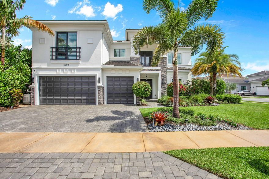 This Callahan model in Royal Palm Polo offers resort-style living on a corner lot w/ a side yard and lots of privacy. Featuring 5 spacious bedrooms, 5.1 bathrooms & office & loft. The grand entrance leads to soaring 23 ft ceilings & abundant natural light through large windows. The gourmet kitchen is equipped with Wolf & Sub-zero appliances, including a gas cooktop. The primary suite offers 2 primary bathrooms & walk-in closets & a serene covered patio overlooking the  pool and private zen like yard. High end light fixtures & window treatments throughout. Located in the gated community of Royal Palm Polo in Boca Raton, this home is conveniently close to top schools and is a non membership community. Full House Generator & AC garage. See photos and Floor Plan