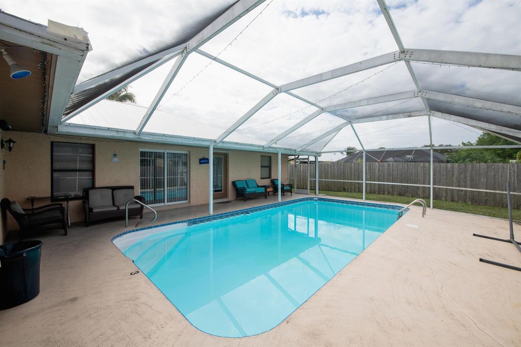 Photo of 455 SE Fallon Drive, Port Saint Lucie, FL 34983 (MLS # R10943652)