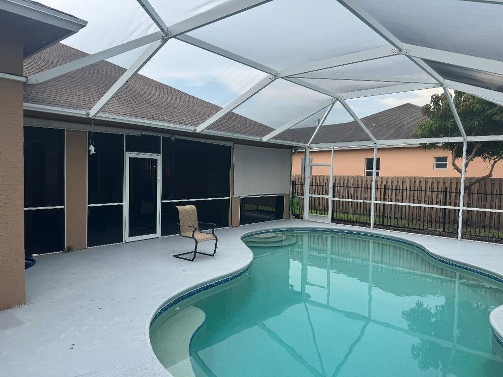 Photo of 5760 NW Cleburn Drive, Port Saint Lucie, FL 34986 (MLS # R11093742)