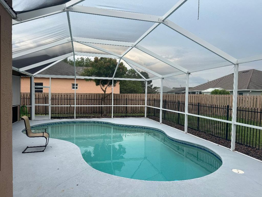 Photo of 5760 NW Cleburn Drive, Port Saint Lucie, FL 34986 (MLS # R11093742)