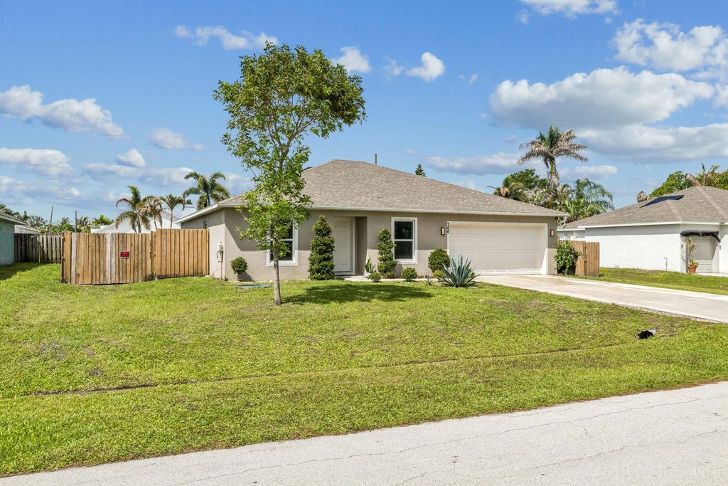 Photo of 766 SE Academy Lane, Port Saint Lucie, FL 34984 (MLS # B26032118)