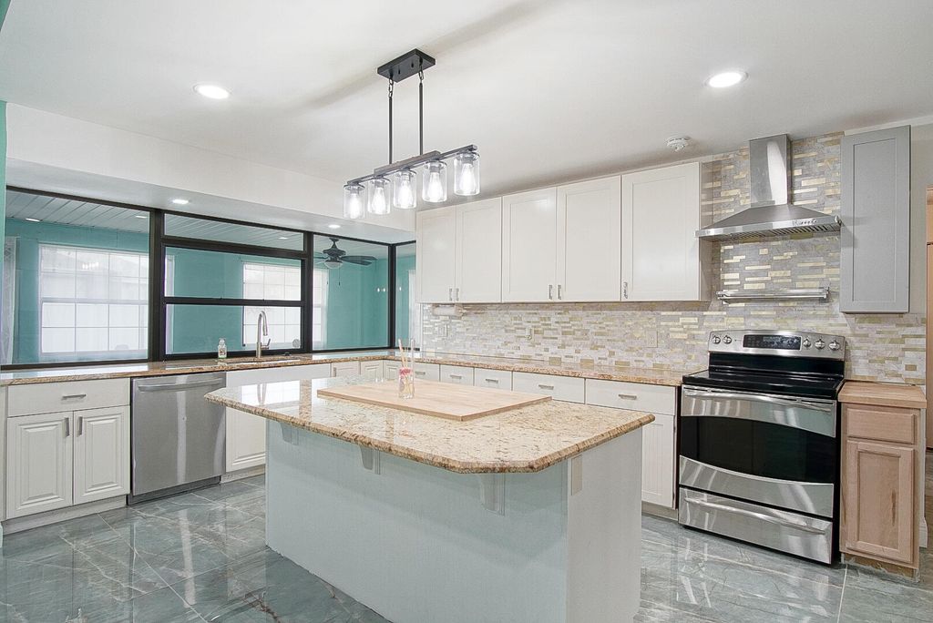 Photo of 1149 SE Menores Avenue, Port Saint Lucie, FL 34952 (MLS # R11141065)