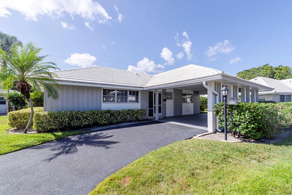 Photo of 127 Driftwood Circle, Atlantis, FL 33462 (MLS # R10933704)