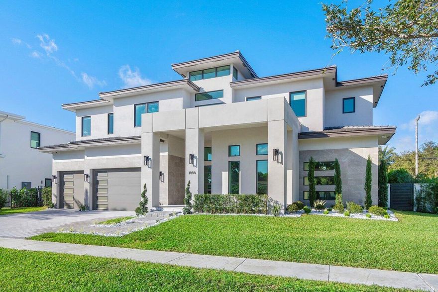 Welcome to Turnkey Exquisite Luxurious Living in the heart of the highly coveted Boca Villas neighborhood. This stunning 2 story residence offers a seamless blend of sophistication and convenience. Boasting a total of 5 en-suite bedrooms and 5.2 bathrooms, this home is designed for both elegance and functionality. The main floor features a beautiful master suite with his and her walk-in closets and vanities, providing a private oasis of comfort. The impressive porcelain floor entry sets the stage for an open-concept view of the great room,  adorned with tastefully selected Artefacto and RH furnishings, plus, wine room, kitchen, and covered patio, creating a perfect space for entertaining. As you enter through the soaring 28' foyer, you'll be captivated by the detailed backlit tray