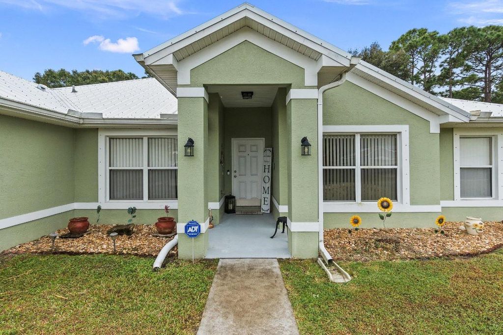 Photo of 1500 SW Hunnicut Avenue, Port Saint Lucie, FL 34953 (MLS # R10941257)