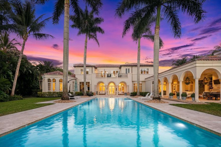 Hamptons style blended with a refined Palm Beach Chic, this newly renovated throughout contemporary inspired lakefront estate is nestled on over 1.4 acres with stunning southwest water views. Designed by award winning architect, Randall Stofft, this residence has previously undergone a two year, $4 Million complete renovation. This impressive residence provides a grand total of 15,164± square feet (11,225 AC) with seven bedrooms and nine and a-half baths – including the guest house which includes a full bathroom and refrigerator/microwave, upstairs/downstairs laundry rooms, an elevator, and a full-house generator. Select finishes feature marble and wide-plank wood floors, hand-forged custom balustrades, and impact-glass windows and exterior doors.The baths have Waterworks and Toto fixtures Thassos marble and dolomite finishes, and custom cabinetry of cerused white oak and walnut. Comprehensive smart-house automation incorporates commercial-grade nine-zone HVAC systems with ultraviolet purification and Nest thermostats, Sonos and Savant audio visual systems with Stealth speakers, Lutron LED lighting, and a sophisticated security system. A gorgeous oversized loggia offers direct lake view across the 65Â±foot-long vanishing-edge pool and spa lined by statuesque palms. Another loggia serves as an outdoor living/dining room with an elegant fireplace, a summer kitchen, and full cabana bath. 

First Floor: Inside the gracious entrance way, the double-height marble foyer features a dramatic customized staircase and has a powder room adjacent. Directly ahead, views of the pool and lake stretch through the elegant open living room, centered on a fireplace, with arch-topped French doors leading to the covered outdoor area. Another fireplace and custom built-ins offered in the library which also opens to the lakeside outdoor area. Across the gallery, the dining room opens to a private garden and is served by a butler's pantry and climate-controlled wine room. Done in crisp white tones, the epicurean's kitchen includes custom cabinetry, stone counters, a BlueStar gas range, Miele convection/steam ovens, two Miele warming drawers, two Miele dishwashers, and a Sub-Zero refrigerator. French doors join the airy open family/breakfast room to the lakeside loggia with summer kitchen. Next to this room are the custom-fitted theater room and office. Across the foyer, another gallery enters the large private wing that encompasses the master suite. Serene tree-framed lake views fill the comfortably elegant master bedroom through the step-down sitting area where French doors open to the lawns. Two customized wardrobe rooms accompany the suite's two spa-like white marble baths, one with a free-standing soaking tub and frameless glass shower. A separate staff suite is also on this level. 

Second Floor: Arranged off the upstairs loft, four bedroom suites include two which open to a terrace taking in the lake view and sunset. French doors also lead to the terrace from the open loft area. 

Guest House: The separate guest house provides a living room, kitchenette, bedroom, and bath.