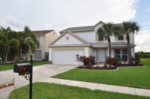 Move-in ready 4 bedroom/ 2.5 bath/ 2 car garage single family lakefront home in highly desirable Boca Winds. This home is situated on one of the largest and nicest lots in the community. Large neutral tile throughout, wood kitchen with granite countertops, spacious bedrooms, large 400 square foot screened in patio with tranquil views of the lake, large backyard (room for a pool and no rear neighbors). 2006 foam insulated roof, hurricane impact windows throughout, newer a/c and hot water heater, lots of storage and closet space. Walk or bike to all A rated schools and A+ shopping. Community offers two swimming pools (one heated), basketball courts, tennis, playground, and clubhouse. Please note that washer/dryer excluded from sale.