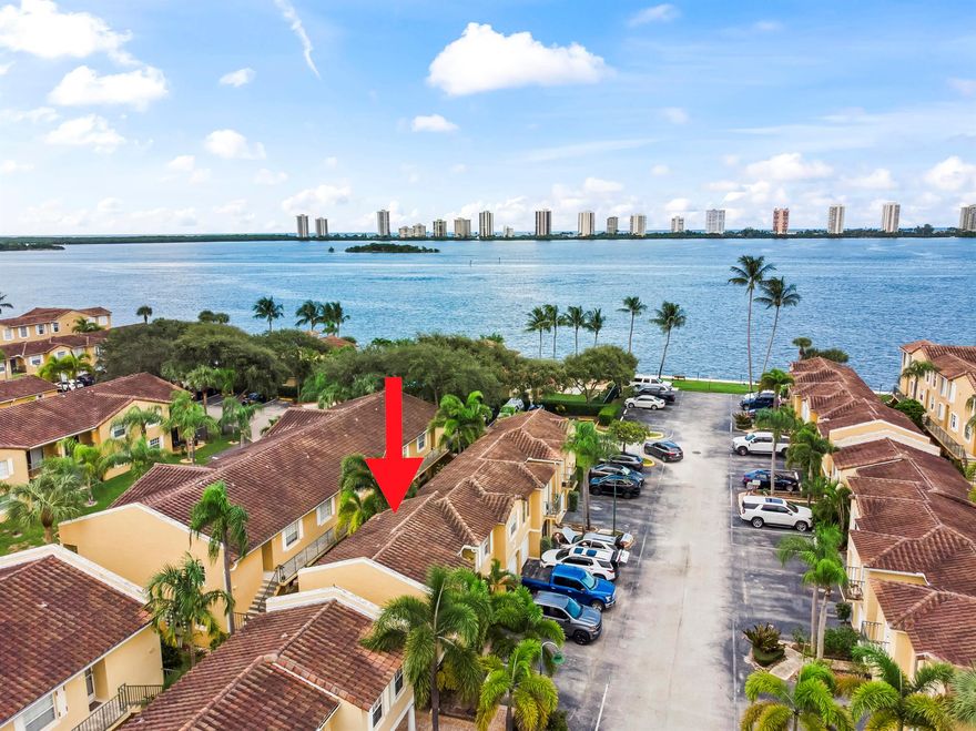 Welcome to Bay Reach, a gated Mediterranean-style community on the Intracoastal offering resort-style living with a heated pool, spa, fitness center, clubhouse on the water, and a private beach for sunrise walks. This fully furnished 2-story condo is available October 15, 2025, pets allowed and one assigned parking space plus guest parking. The first floor features a private bedroom and full bath, ideal for guests, while the second floor offers the master suite, open living and dining, and a sleek European-style kitchen. Enjoy stylish modern furnishings, beautiful water views, and a quiet, well-maintained neighborhood just minutes from The Gardens Mall, Downtown West Palm Beach, City Place, shops, restaurants, and beaches.