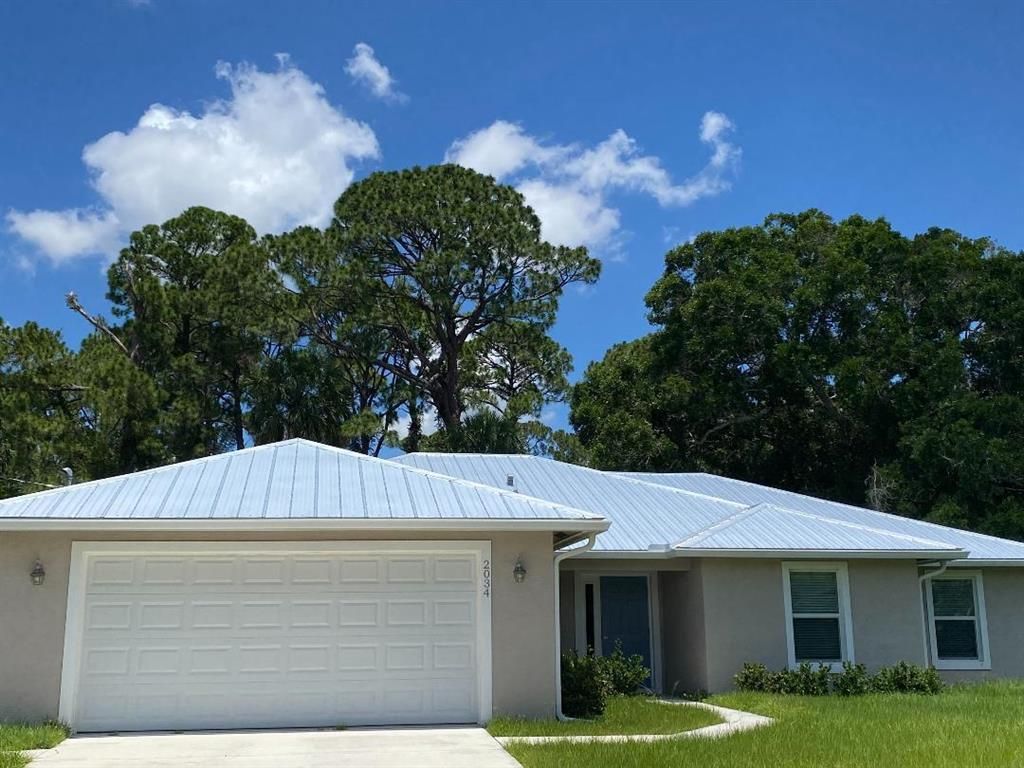 Photo of 2034 SW Tropical Terrace, Port St Lucie, FL 34953 (MLS # R10878320)